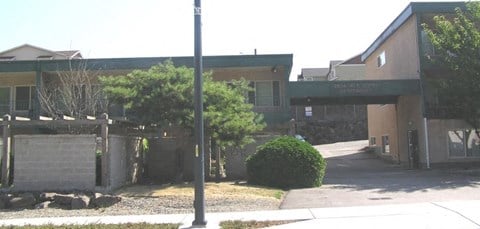 a building with an overpass and a sidewalk